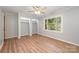 Bedroom with hardwood floors, light gray walls, a ceiling fan, and closet space at 114 Elmwood Dr, Salisbury, NC 28147