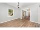 Inviting dining room with hardwood floors, neutral paint, and a large window overlooking the backyard at 114 Elmwood Dr, Salisbury, NC 28147