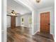 Open living room with hardwood floors, a ceiling fan, and a sliding barn door to another room at 114 Elmwood Dr, Salisbury, NC 28147