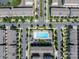 Aerial view of community pool with manicured landscaping and surrounding townhomes with ample parking at 1142 Doveridge St, Charlotte, NC 28273