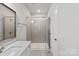 Bathroom featuring glass enclosed shower, vanity with modern sink, and good lighting at 1142 Doveridge St, Charlotte, NC 28273