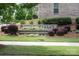Landscaped community sign with decorative brick and colorful flowerbeds at 1142 Doveridge St, Charlotte, NC 28273