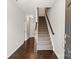Inviting foyer with hardwood floors, staircase, and a view into other rooms of the home at 1142 Doveridge St, Charlotte, NC 28273