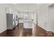 Bright kitchen with wood flooring, stainless steel appliances, and a center island at 1142 Doveridge St, Charlotte, NC 28273