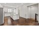 Well-lit kitchen featuring wood floors, a center island, and staircase access at 1142 Doveridge St, Charlotte, NC 28273