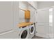 A laundry room with new, matching, front-load washer and dryer at 1142 Doveridge St, Charlotte, NC 28273