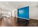 Bright open-concept living room with hardwood floors flows seamlessly into the kitchen, perfect for entertaining at 1142 Doveridge St, Charlotte, NC 28273