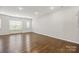 Living room with hardwood flooring and windows allowing plenty of natural light at 1142 Doveridge St, Charlotte, NC 28273