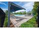 Community pool with sundeck, lounge chairs, covered seating areas, and manicured landscaping at 1142 Doveridge St, Charlotte, NC 28273