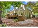 Backyard view featuring a spacious deck and lush landscaping at 12711 Duncourtney Ln, Charlotte, NC 28277