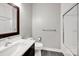 Bright bathroom featuring a framed mirror, white countertop, a toilet, and a glass shower at 12711 Duncourtney Ln, Charlotte, NC 28277