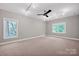 Spacious bedroom with track lighting and two windows with outdoor views at 12711 Duncourtney Ln, Charlotte, NC 28277