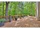 Outdoor deck with wooden floors, railing, and decorative plants at 12711 Duncourtney Ln, Charlotte, NC 28277