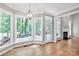 Bright dining room with large windows offering scenic outdoor views and natural light at 12711 Duncourtney Ln, Charlotte, NC 28277