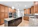 Elegant kitchen boasts custom cabinets, granite countertops, and a spacious center island at 12711 Duncourtney Ln, Charlotte, NC 28277