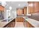 Gourmet kitchen with custom cabinets, granite countertops, island, and stainless steel appliances at 12711 Duncourtney Ln, Charlotte, NC 28277