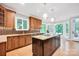 Gourmet kitchen with custom cabinets, granite countertops, island, and stainless steel appliances at 12711 Duncourtney Ln, Charlotte, NC 28277