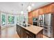 Gourmet kitchen features a large island, stainless steel appliances, and granite countertops at 12711 Duncourtney Ln, Charlotte, NC 28277