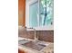 Close up view of a stainless steel kitchen sink with a modern faucet and tiled backsplash at 12711 Duncourtney Ln, Charlotte, NC 28277