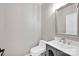 Stylish powder room featuring a modern vanity, sink, and toilet at 12711 Duncourtney Ln, Charlotte, NC 28277