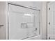 Shower features white tile, a glass door, built in shelf, and a shower head at 12711 Duncourtney Ln, Charlotte, NC 28277