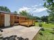 Brick home with new deck & patio, set in a spacious backyard with lush lawn at 1306 Abbey Ct, Lancaster, SC 29720