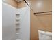 A clean bathroom features a white shower stall with built-in shelving and matching toilet at 1306 Abbey Ct, Lancaster, SC 29720