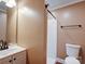 A tidy bathroom features a sink and vanity next to the toilet with a shower stall at 1306 Abbey Ct, Lancaster, SC 29720
