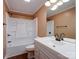 Clean bathroom featuring a tub, shower combo, updated vanity, and modern fixtures at 1306 Abbey Ct, Lancaster, SC 29720