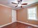 Cozy bedroom with hardwood floors, a ceiling fan, one window, and white trim at 1306 Abbey Ct, Lancaster, SC 29720