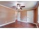 Comfortable bedroom featuring hardwood floors, a ceiling fan, and two access doors at 1306 Abbey Ct, Lancaster, SC 29720