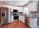 Modern kitchen features stainless steel appliances, granite countertops, and updated cabinetry at 1306 Abbey Ct, Lancaster, SC 29720