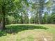 Expansive vacant land with mature trees, offering a serene setting at 1306 Abbey Ct, Lancaster, SC 29720