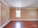 Bright living room with hardwood floors, neutral paint, and trim at 1306 Abbey Ct, Lancaster, SC 29720