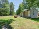 Detached outbuilding with siding and a well-kept lawn, perfect for storage or hobbies at 1306 Abbey Ct, Lancaster, SC 29720