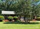 Charming brick home featuring a well-manicured lawn and mature trees, offering great curb appeal at 1412 Beverly Ave, Shelby, NC 28152