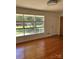 Bright living room with hardwood floors and large windows offering a pleasant view at 1412 Beverly Ave, Shelby, NC 28152