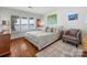 Comfortable bedroom with lake views, natural light, and hardwood floors at 15 Old Stage Trl, Clover, SC 29710
