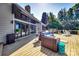 Expansive wooden deck features comfortable seating with lake views through the sliding doors at 15 Old Stage Trl, Clover, SC 29710