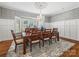 Chic dining room with decorative wallpaper, wainscoting, and a large bay window at 15 Old Stage Trl, Clover, SC 29710