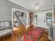 Charming foyer features hardwood floors, an elegant rug, and a view of the staircase at 15 Old Stage Trl, Clover, SC 29710