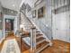 Entry hallway with wood stairs, neutral paint, and a decorative rug at 15 Old Stage Trl, Clover, SC 29710