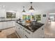 Bright kitchen featuring a large island with cooktop and bar stool seating at 15 Old Stage Trl, Clover, SC 29710