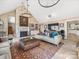 Inviting living room with stone fireplace, built-in shelving and coffered wall detail at 15 Old Stage Trl, Clover, SC 29710