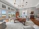 Bright living room featuring hardwood floors, sliding doors, and serene lake views at 15 Old Stage Trl, Clover, SC 29710
