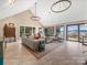 Bright living room featuring water views and sliding doors to deck at 15 Old Stage Trl, Clover, SC 29710