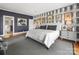 Spacious main bedroom showcasing decorative wallpaper, carpet, and ample natural light at 15 Old Stage Trl, Clover, SC 29710
