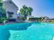 Backyard view featuring a pristine pool, lounge chairs, deck, and lush landscaping at 15 Old Stage Trl, Clover, SC 29710