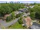 Aerial view shows the houses on tree-lined streets with a city skyline view at 1500 Lynway Dr, Charlotte, NC 28203