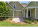 The home's backyard features a concrete patio and beautiful landscaping at 1500 Lynway Dr, Charlotte, NC 28203